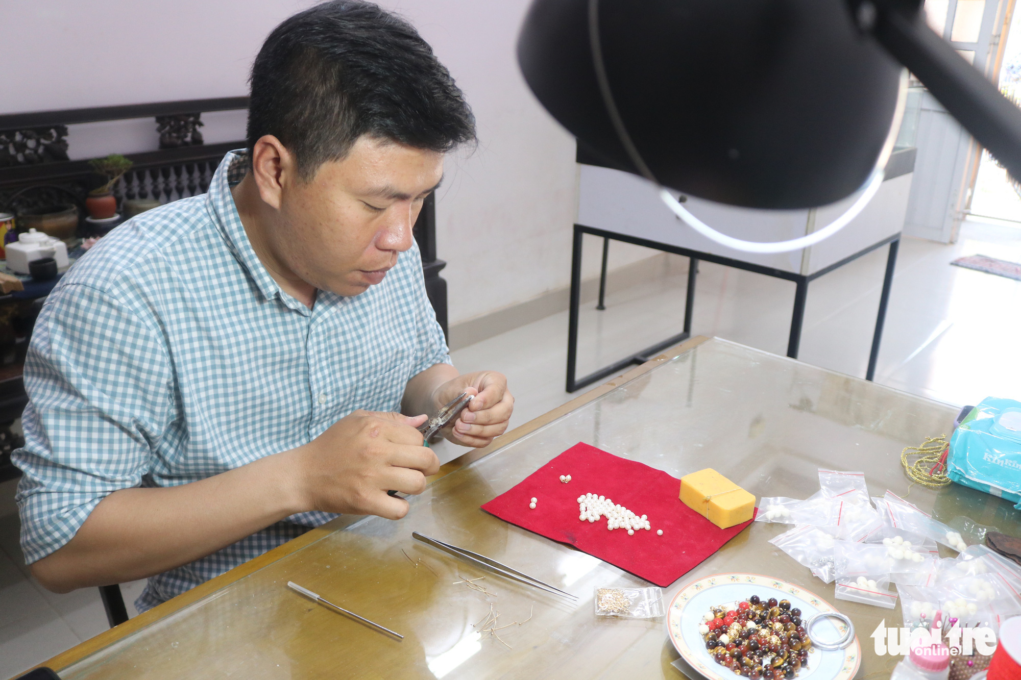 Tran Quang Minh Tan makes buttons for Nguyen Dynasty clothing