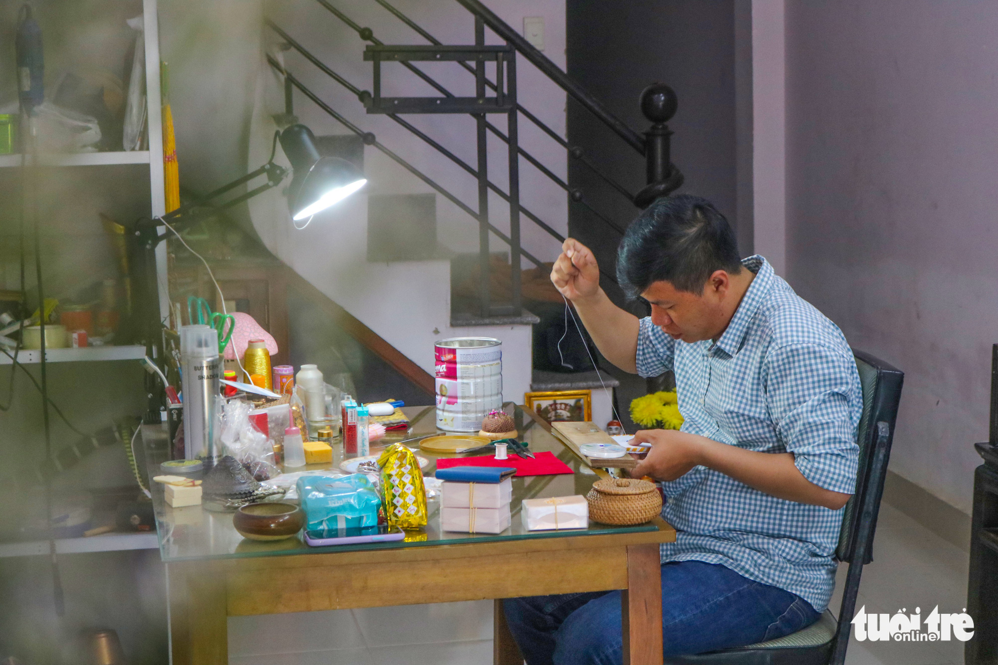 Tran Quang Minh Tan makes buttons for Nguyen Dynasty clothing