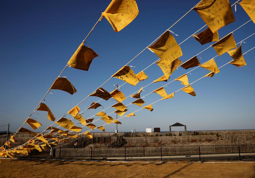 Yellow handkerchiefs bearing messages supporting people in areas hit by the 2011 earthquake and tsunami are hanged at Iwaki 3.11 Memorial and Revitalisation museum ahead of the ten years anniversary of the disaster in Iwaki, Japan, March 10, 2021. Photo: Reuters