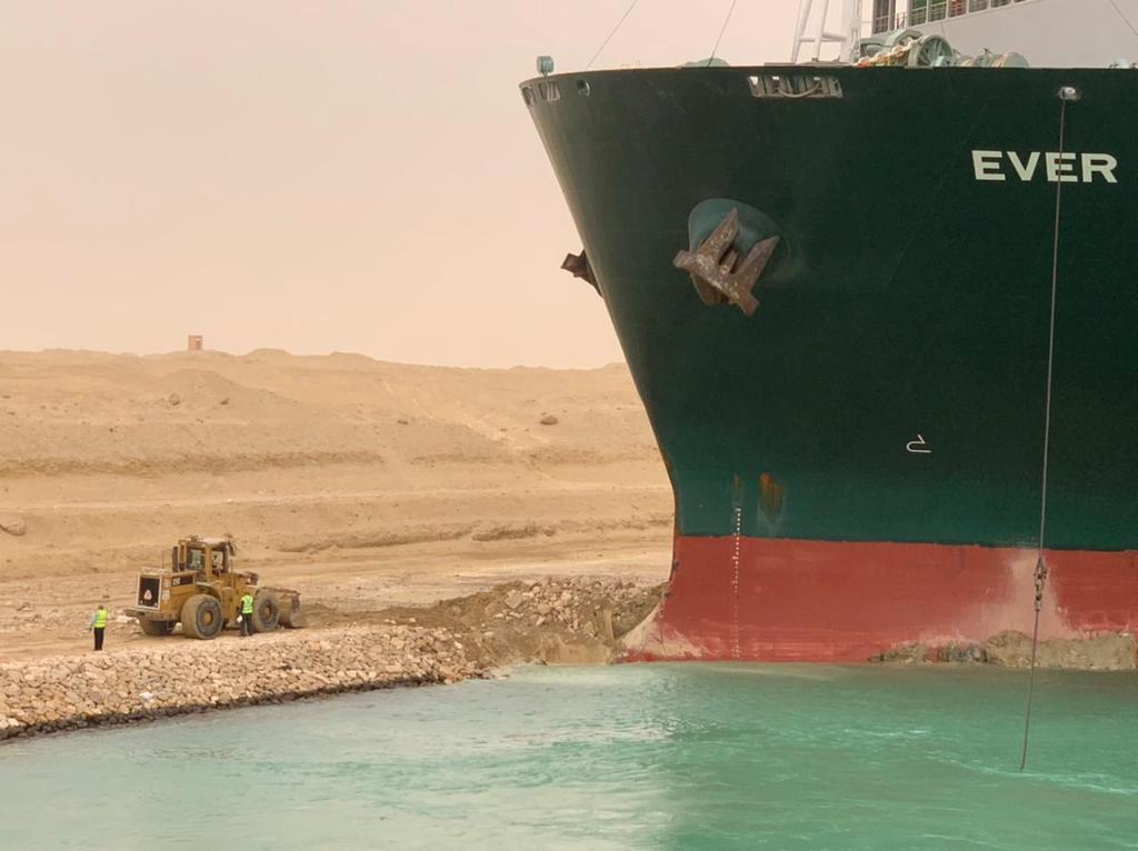 A truck carrying Evergreen containers, waits to pass through the main gate of the El Ain El Sokhna port to Suez Canal, Egypt March 24, 2021. Photo: Reuters