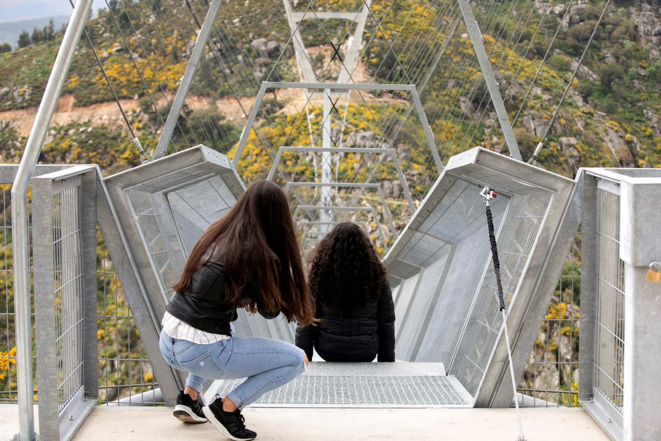 People look at the world's longest pedestrian suspension bridge '516 Arouca', now open for local residents in Arouca, Portugal, April 29, 2021. Photo: Reuters