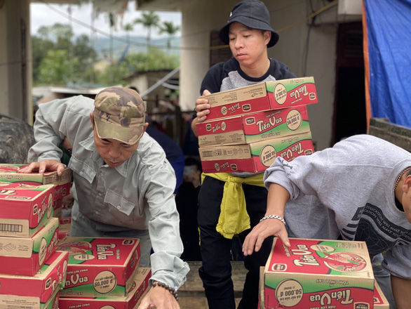 Nguyen Quan Tan (fourth, right) and other volunteers are seen at the opening of a bridge to traffic in Ca Mau Province, Vietnam in this supplied photo.