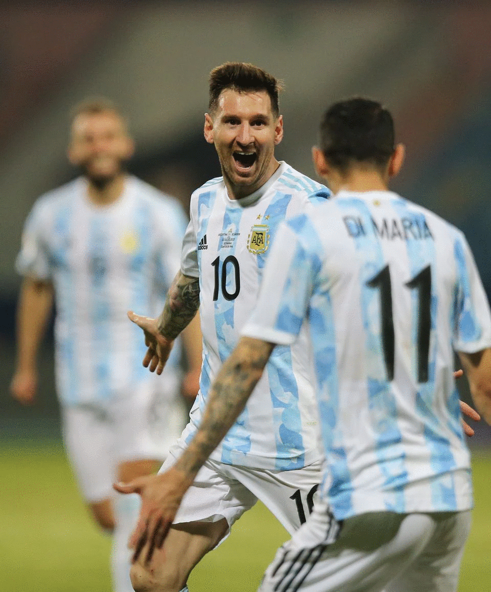 Soccer Football - Copa America 2021 - Quarter Final - Argentina v Ecuador - Estadio Olimpico, Goiania, Brazil - July 3, 2021 Argentina's Lionel Messi celebrates scoring their third goal with Angel Di Maria. Photo: Reuters