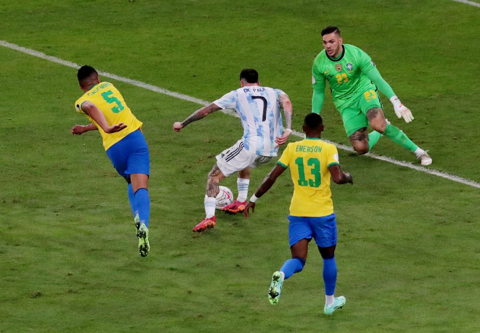 Soccer Football - Copa America 2021 - Final - Brazil v Argentina - Estadio Maracana, Rio de Janeiro, Brazil - July 10, 2021 Argentina's Rodrigo De Paul in action with Brazil's Ederson. Photo: Reuters