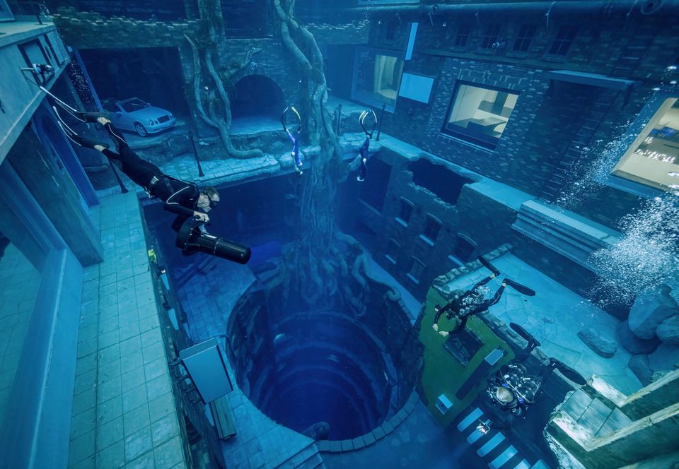 A view of scuba divers at the Deep Dive Dubai, the deepest pool in the world, in Dubai, United Arab Emirates, in this handout image taken in July 2021. Deep Dive Dubai/Handout via Reuters