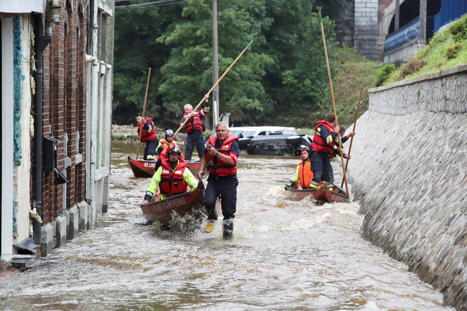 Austrian rescue team members use their boats as they go through an area affected by floods, following heavy rainfalls, in Pepinster, Belgium, July 16, 2021. Photo: Reuters