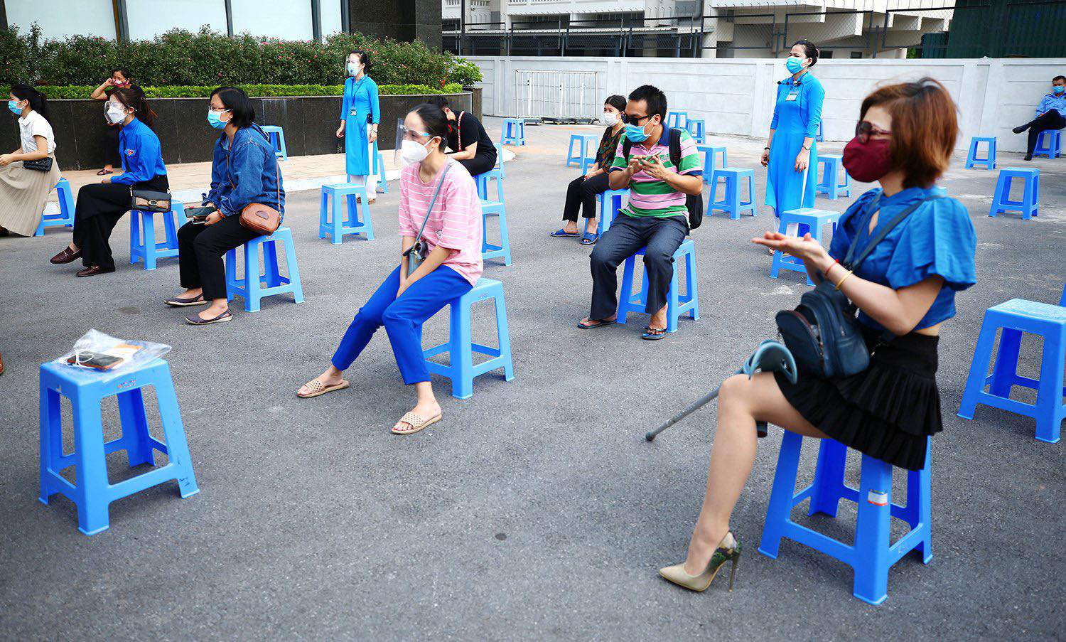 Disabled workers wait for a COVID-19 vaccination session in Hanoi, July 29, 2021. Photo: Ministry of Planning and Investment