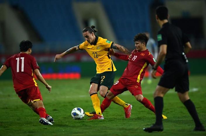 Australia's midfielder Jackson Irvine (C) controls the ball next to Vietnam's midfielder Quang Hai Nguyen (2nd R) during the FIFA World Cup Qatar 2022 qualifying round Group B football match between Australia and Vietnam at the My Dinh National Stadium in Hanoi on September 7, 2021. Photo: AFP