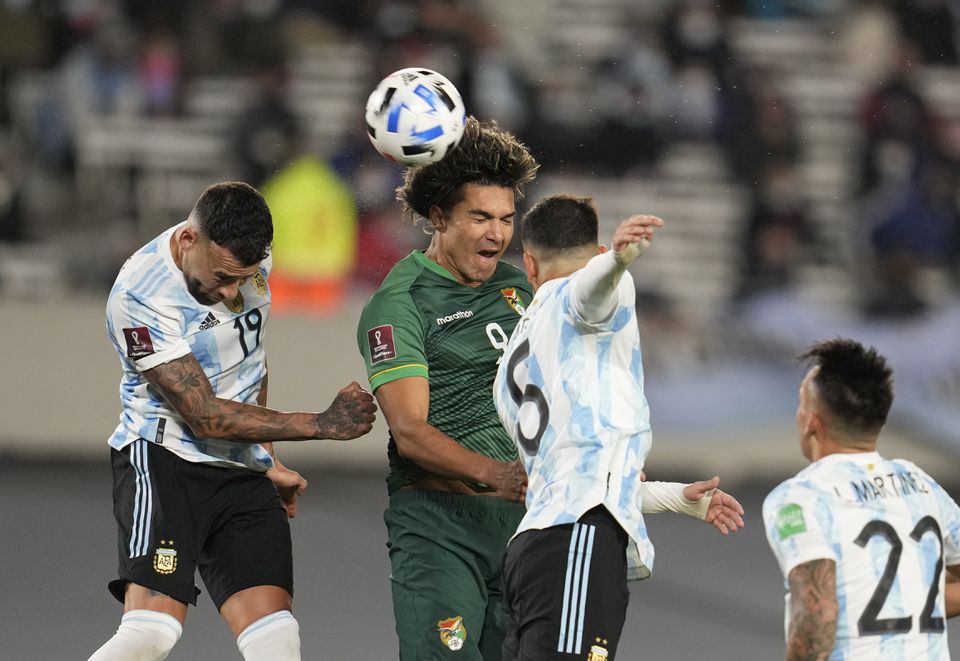 Soccer Football - World Cup - South American Qualifiers - Argentina v Bolivia - El Monumental, Buenos Aires, Argentina - September 9, 2021 Bolivia's Marcelo Moreno in action with Argentina's Leandro Paredes and Nicolas Otamendi. Pool via Reuters