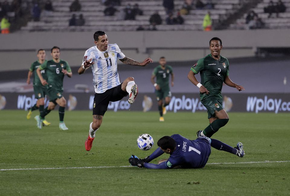 Soccer Football - World Cup - South American Qualifiers - Argentina v Bolivia - El Monumental, Buenos Aires, Argentina - September 9, 2021 Argentina's Angel Di Maria in action with Bolivia's Carlos Lampe. Pool via Reuters