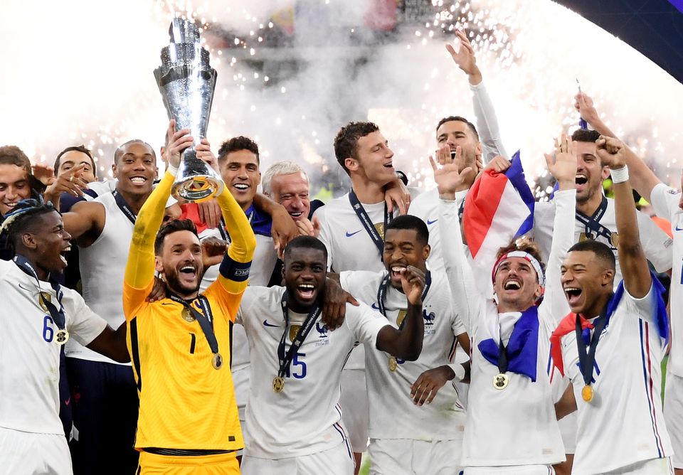 Soccer Football - Nations League - Final - Spain v France - San Siro, Milan, Italy - October 10, 2021 France's Hugo Lloris lifts the trophy as they celebrate after winning the Nations League. Photo: Reuters