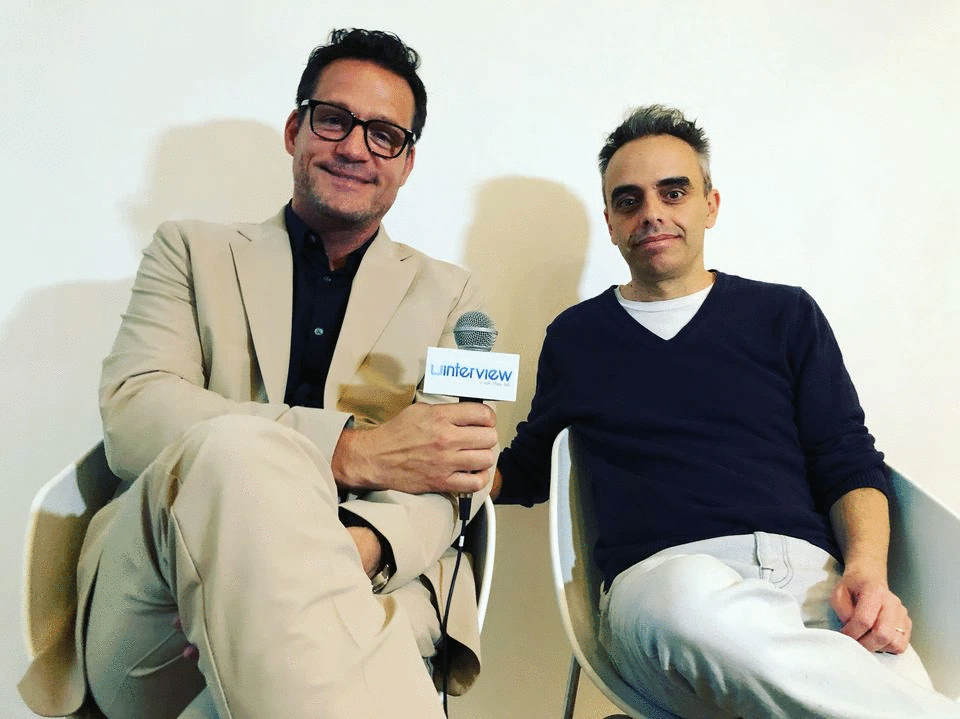 Director Joel Souza (R) is pictured with Josh Hopkins during an interview session at the uInterview.com offices in Manhattan, New York, U.S., April 26, 2019, in this handout photo released to Reuters on October 23, 2021. Photo taken April 26, 2019. Photo: Erik Meers/uInterview.com/Handout via Reuters