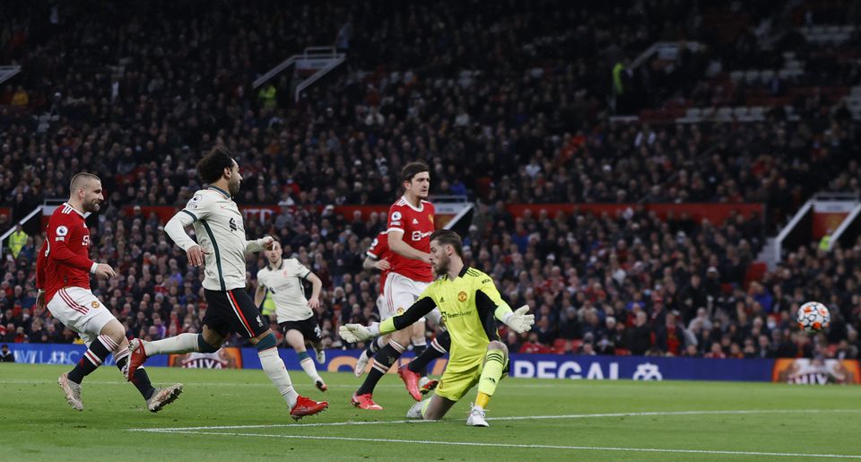 Soccer Football - Premier League - Manchester United v Liverpool - Old Trafford, Manchester, Britain - October 24, 2021 Liverpool's Mohamed Salah scores their fifth goal and his hat-trick. Photo: Reuters