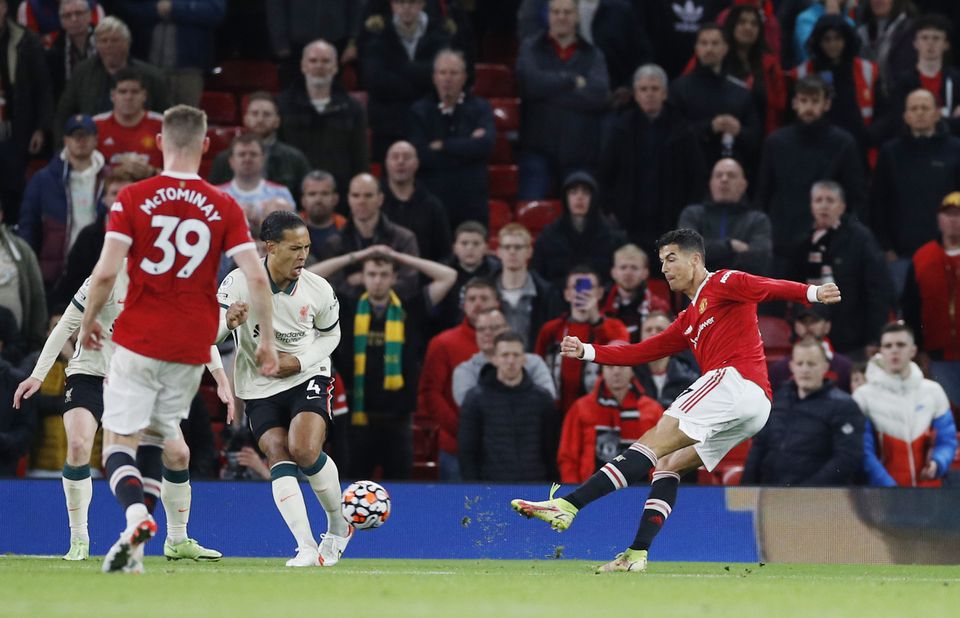 Soccer Football - Premier League - Manchester United v Liverpool - Old Trafford, Manchester, Britain - October 24, 2021 Liverpool's Virgil van Dijk in action with Manchester United's Cristiano Ronaldo. Photo: Reuters