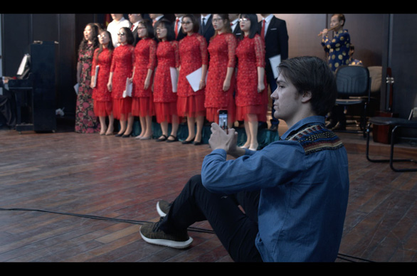 François Bibonne works with a choir while he makes his film in a supplied photo