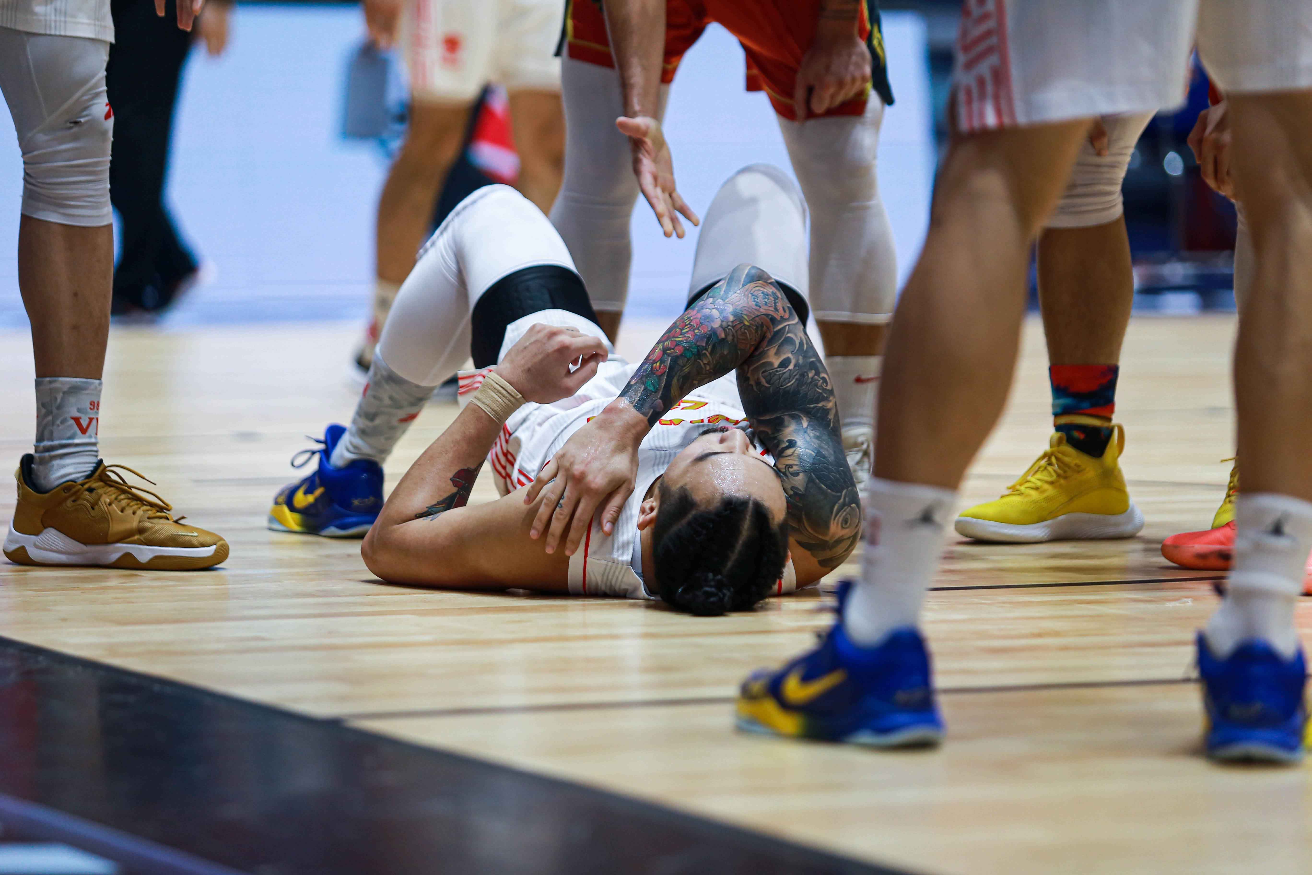 Tam Dinh lies on the floor after landing on his left shoulder. Photo: VBA