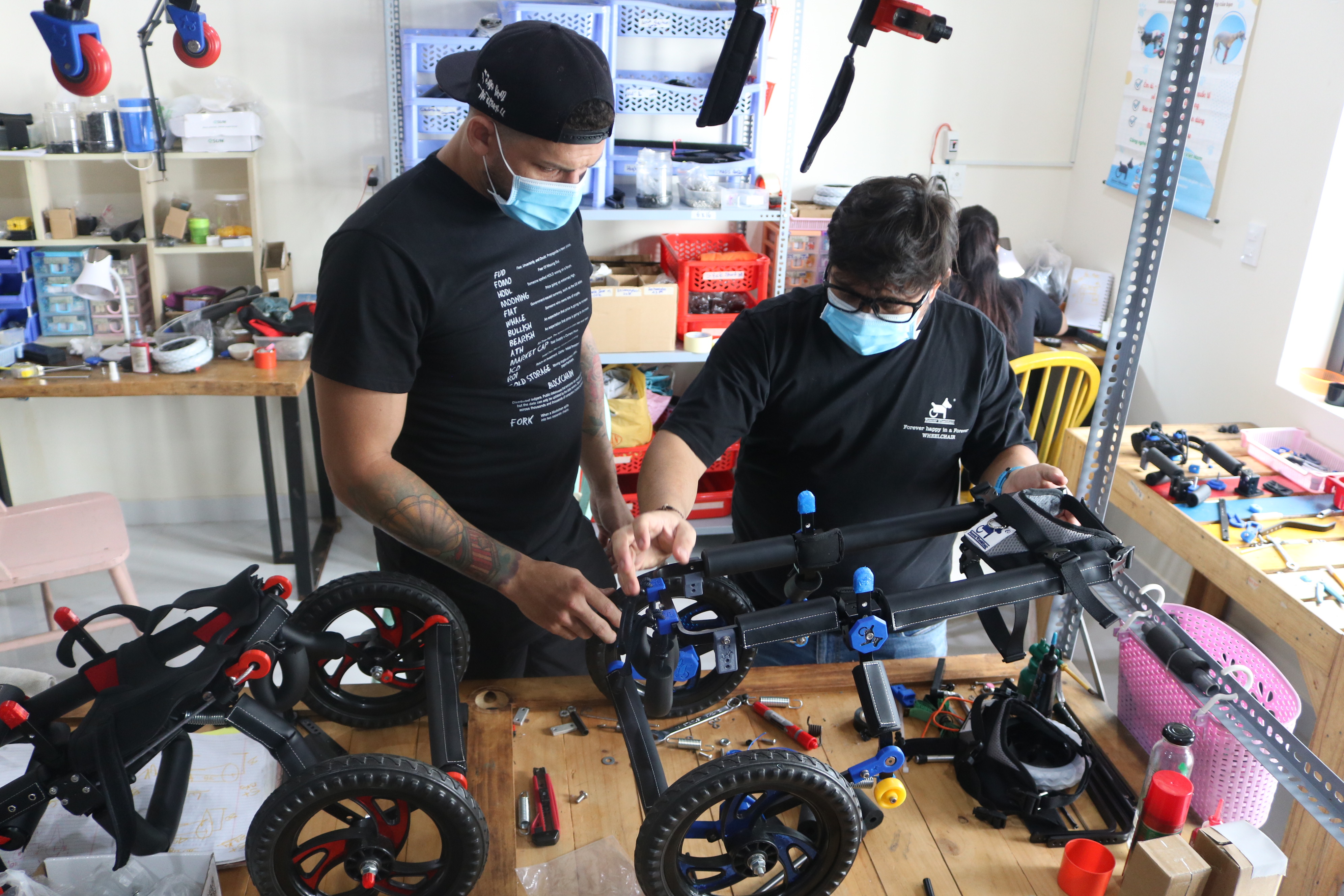 Oscar Fernando Ruiz Bonilla (right) and Ramy Falcon, staff at Forever Wheelchair workshop, are checking a product with its design at the factory in Ho Chi Minh City’s District 9 on October 19, 2021. Photo: Hoang An / Tuoi Tre