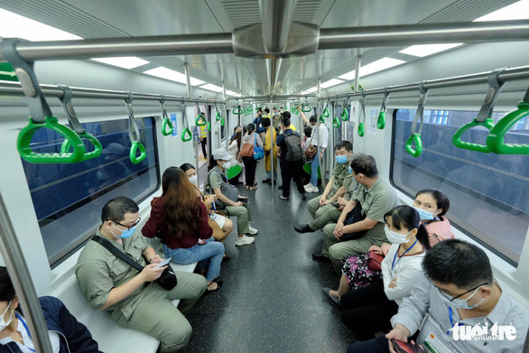 Passengers are seen inside the first train of the Cat Linh - Ha Dong metro line in Hanoi on November 6, 2021. Photo: Nam Tran / Tuoi Tre