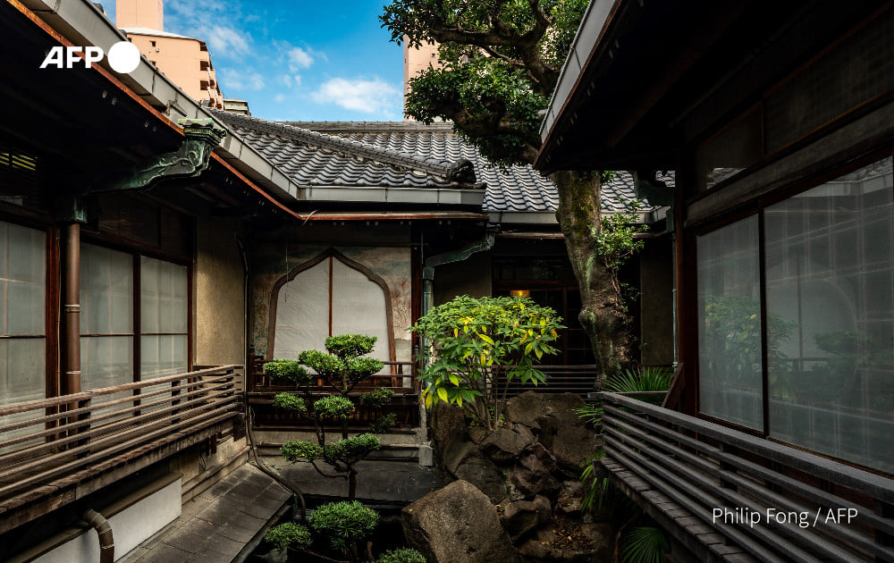 The building's suites surround a garden where towering 'yin and yang' rocks represent men and women. Photo: AFP