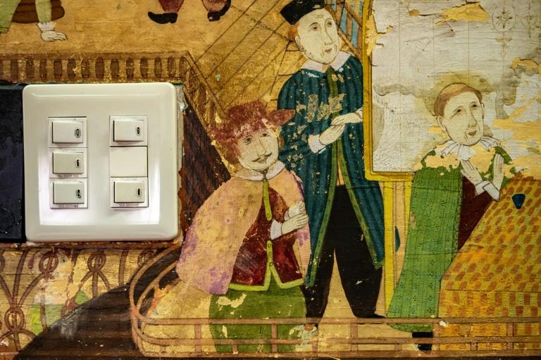 Murals of festivals, goddesses playing traditional instruments and Dutch merchants in old-fashioned clothes adorn the walls. Photo: AFP