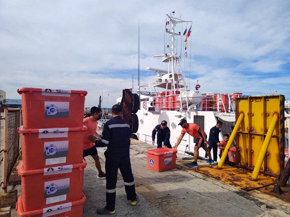 Philippine Coast Guard personnel unload packs of relief goods for victims of Typhoon Rai, in Bacolod City, Negros Occidental, Philippines, December 21, 2021. Philippine Coast Guard/Handout via Reuters