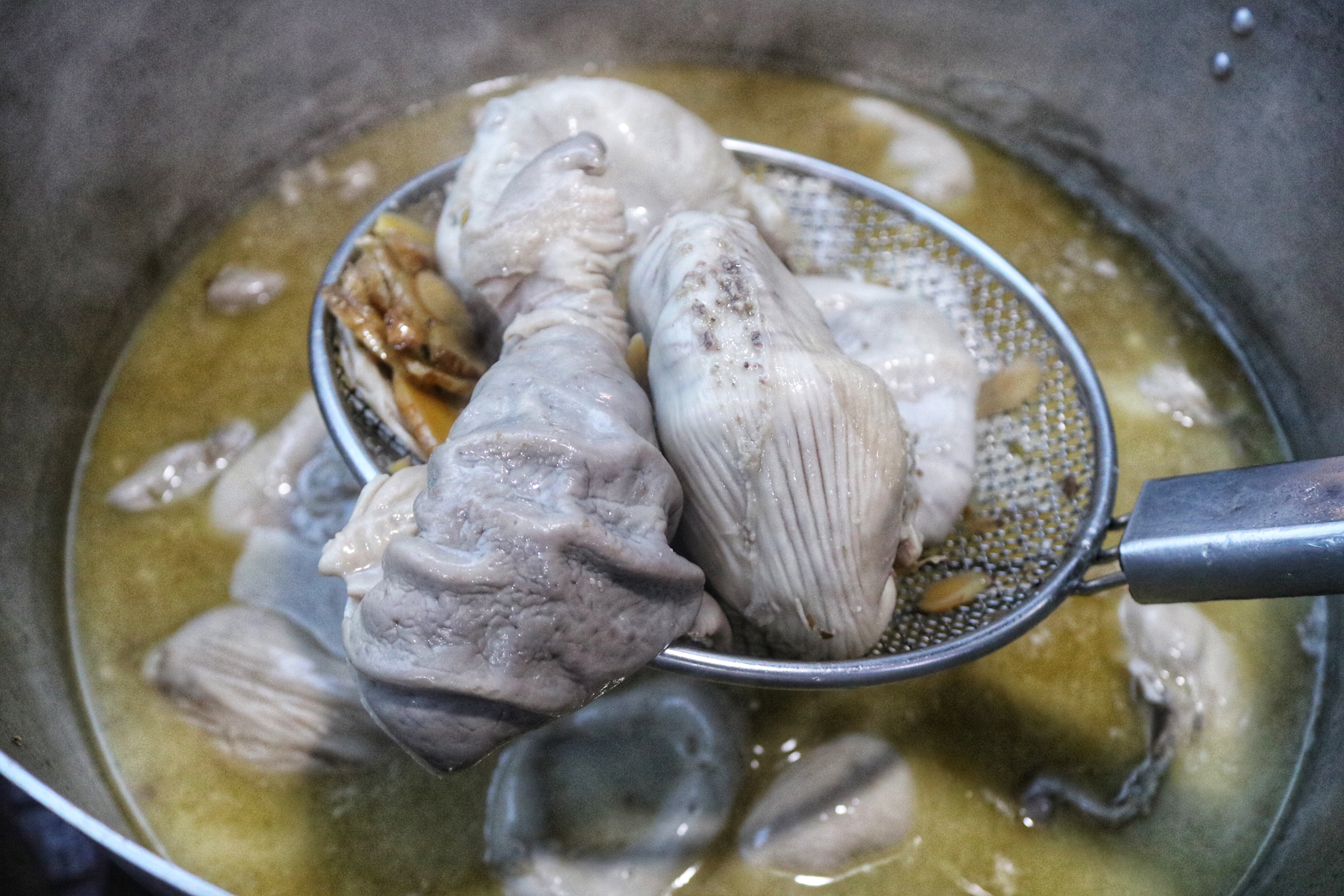 Pig organs are boiled with ginger and other spices to remove their smell. Photo: Hoang An / Tuoi Tre News