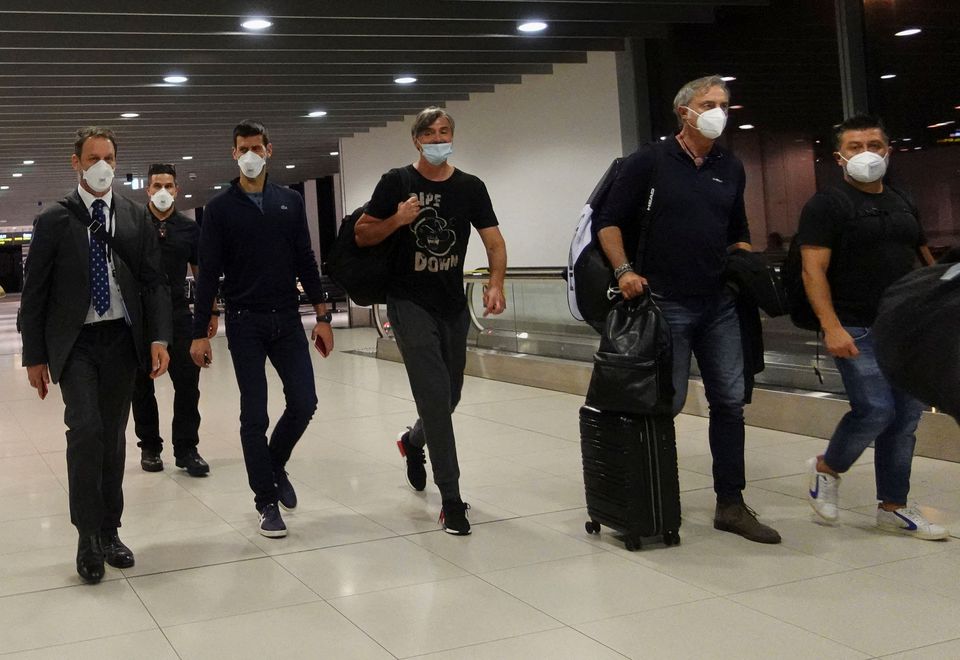 Serbian tennis player Novak Djokovic walks in Melbourne Airport before boarding a flight, after the Federal Court upheld a government decision to cancel his visa to play in the Australian Open, in Melbourne, Australia, January 16, 2022. Photo: Reuters