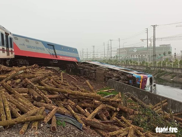 Timbers from the truck are seen at the accident scene. Photo: Khuat Viet Hung