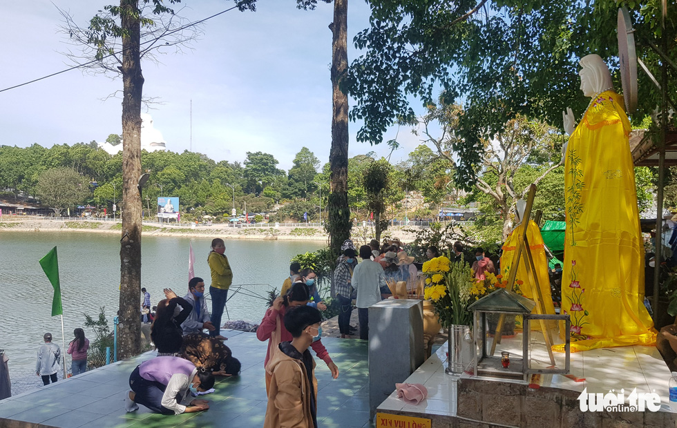 Visitors are seen at a worship area on the top of Cam Mountain in Tinh Bien District, An Giang Province, Vietnam. Photo: Buu Dau / Tuoi Tre