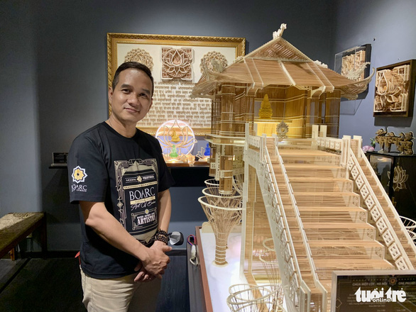 Hoang Tuan Long and his replica of the One-Pillar Pagoda in Hanoi. Photo: Phuong Nam / Tuoi Tre