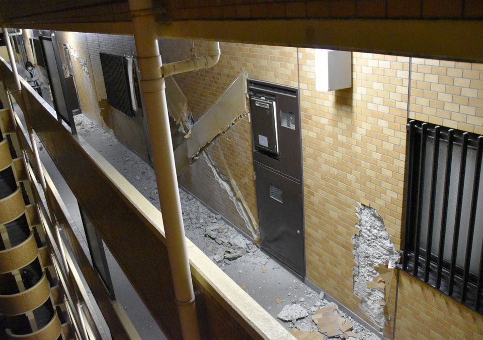 The wall of a condominium building is seen partially collapsed after an eathquake in Fukushima, Japan March 17, 2022, in this photo taken by Kyodo. Mandatory credit Kyodo/via Reuters