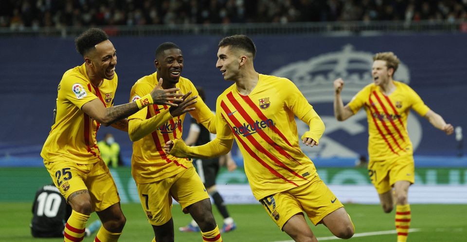 Soccer Football - LaLiga - Real Madrid v FC Barcelona - Santiago Bernabeu, Madrid, Spain - March 20, 2022 FC Barcelona's Ferran Torres celebrates scoring their third goal with teammates. Photo: Reuters