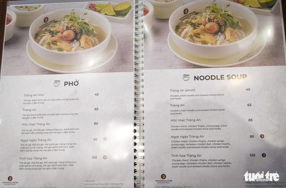 The prices of pho and drinks are seen in the panels at the Noodle House in Vietnam’s central Da Nang City in this image. Photo: Tan Luc / Tuoi Tre