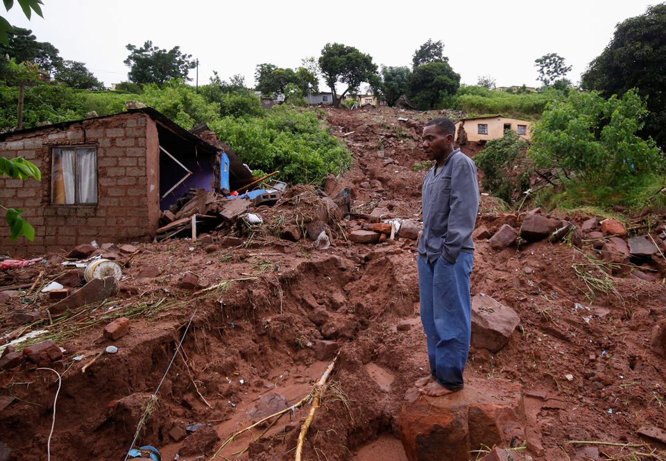 Jomba Phiri walks over where his house stood after heavy rains caused flood damage in KwaNdengezi, Durban, South Africa, April 12, 2022. Photo: Reuters