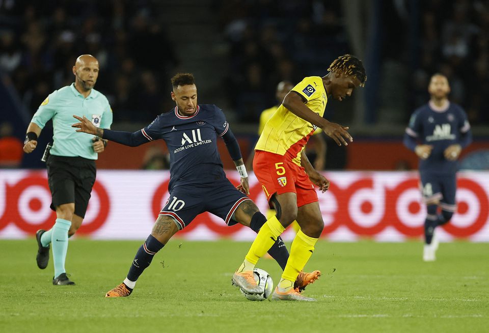 Soccer Football - Ligue 1 - Paris St Germain v RC Lens - Parc des Princes, Paris, France - April 23, 2022 RC Lens' Christopher Wooh in action with Paris St Germain's Neymar. Photo: Reuters