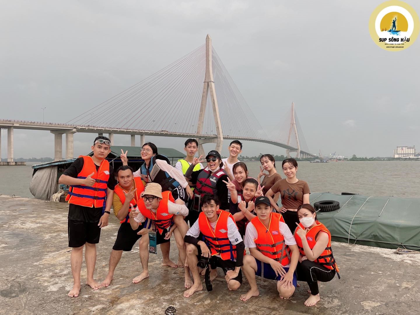 A group of young people pose for a photo after their SUP trip on the Hau River in Can Tho City, Vietnam. Photo: Huynh Quoc Long/ Handout via Tuoi Tre