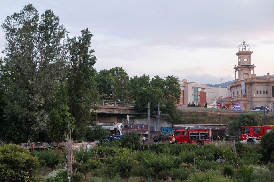 Spanish first responders attend to the scene, after a commuter train and a goods train collided, on the outskirts of Barcelona, Spain May 16, 2022. Photo: Reuters