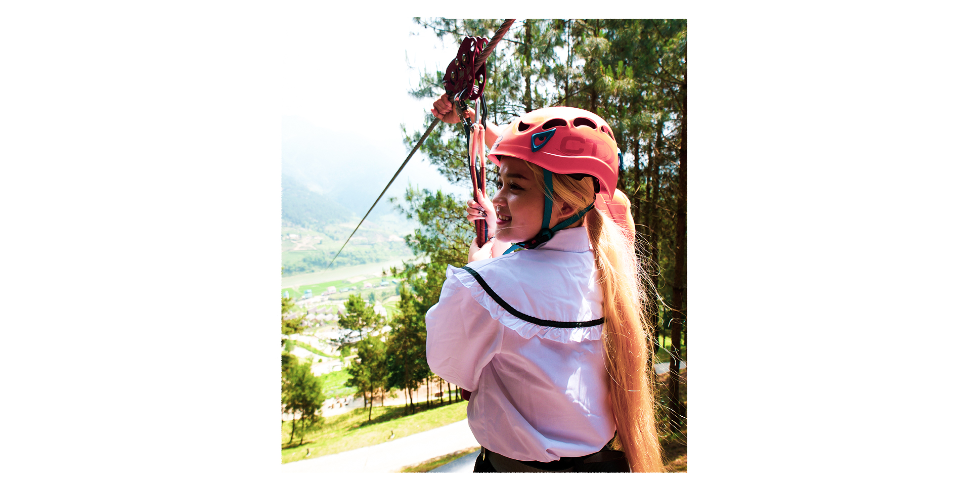 A woman experiences the zip line service at Le Champ Tu Le Resort Hot Spring & Spa in Van Chan District, Yen Bai Province, Vietnam. Photo: Nam Tran / Tuoi Tre