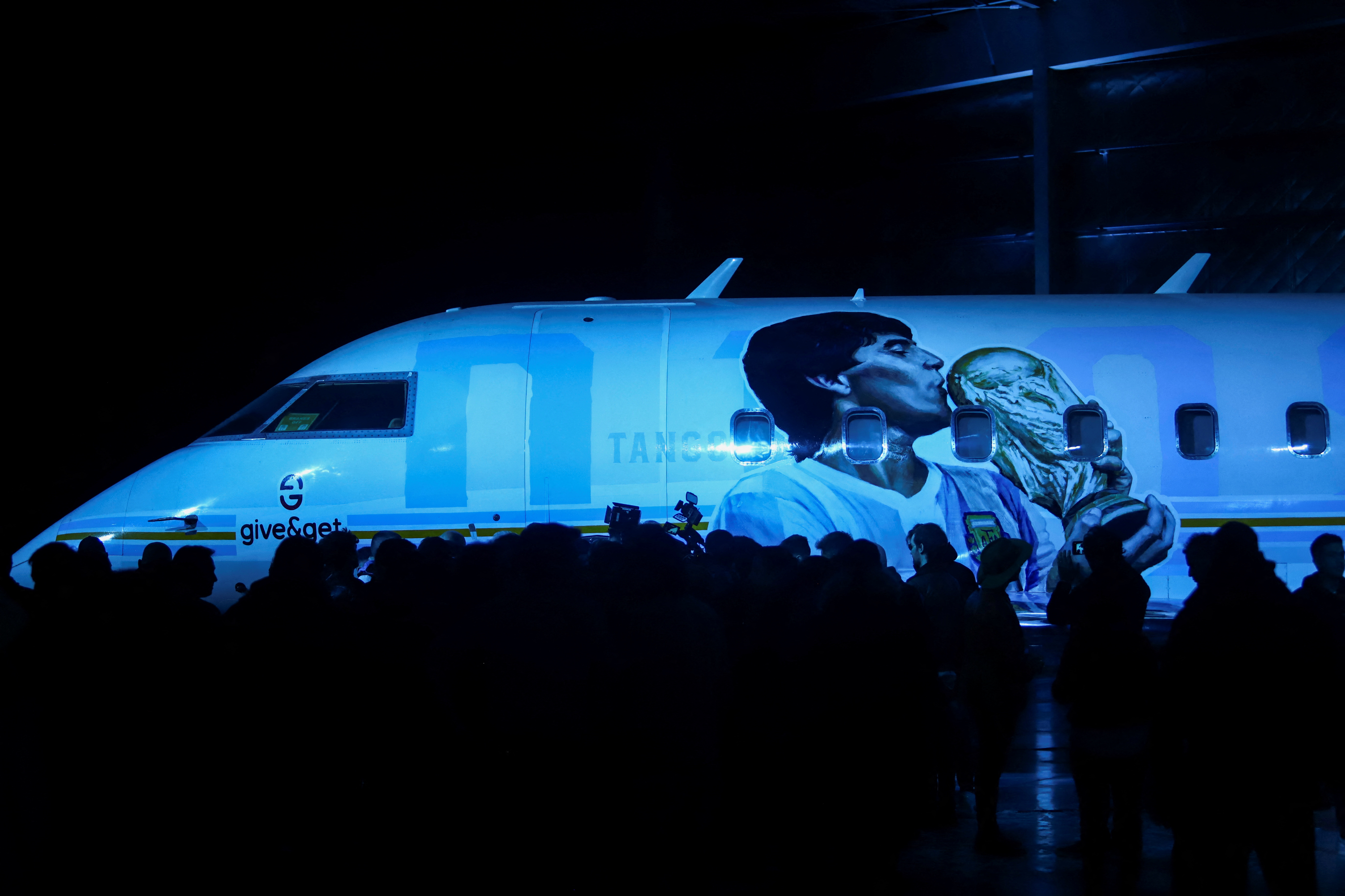 People take part in an event to launch the world tour to Qatar’s World Cup of the TANGO D10S, a themed airplane with a museum with objects used by late soccer legend Diego Armando Maradona, in Buenos Aires, Argentina May 25, 2022. Photo: Reuters