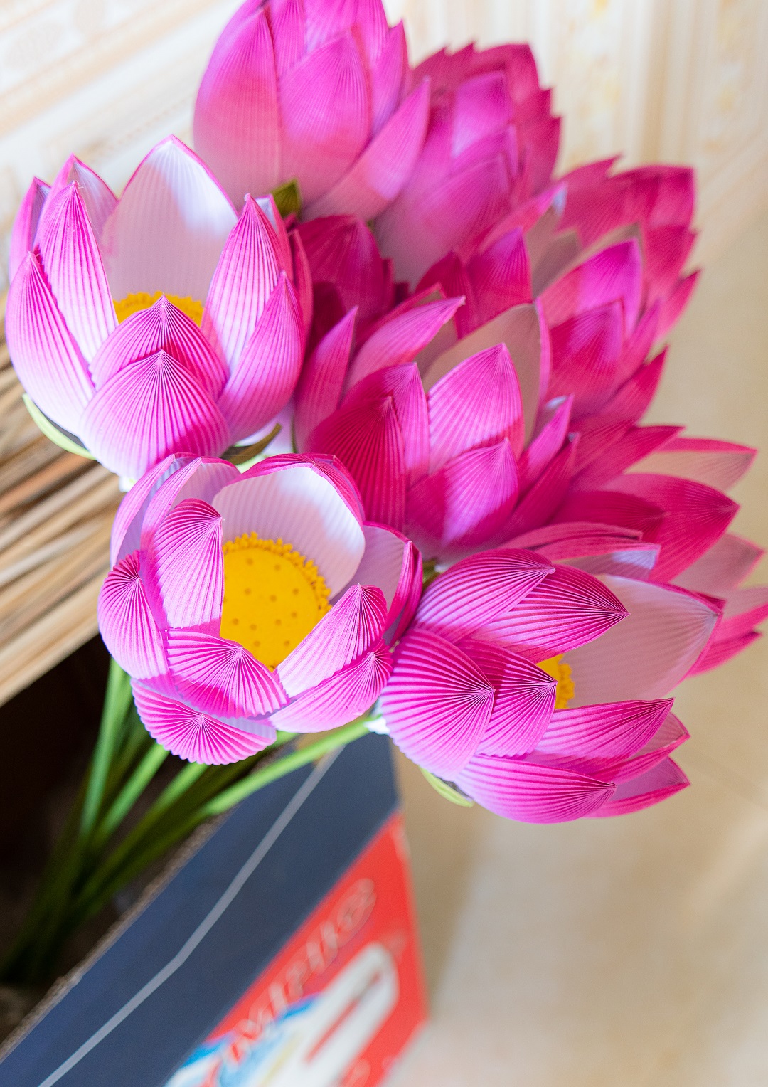 A bunch of paper lotus flowers, which are considered a signature product of Thanh Tien Village. Petals of the flowers are shaped carefully before being glued together to bamboo branches. Photo: Nguyen Trung Au / Tuoi Tre News