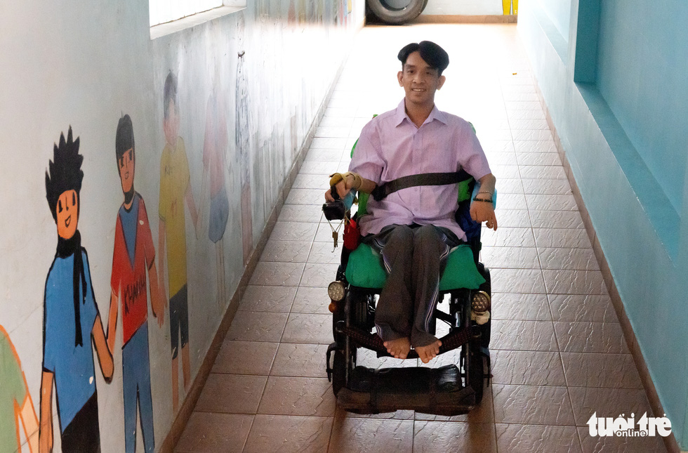 Nguyen Ngoc Lam is watching a mural of kids. He hopes that one day he is able to be a father.