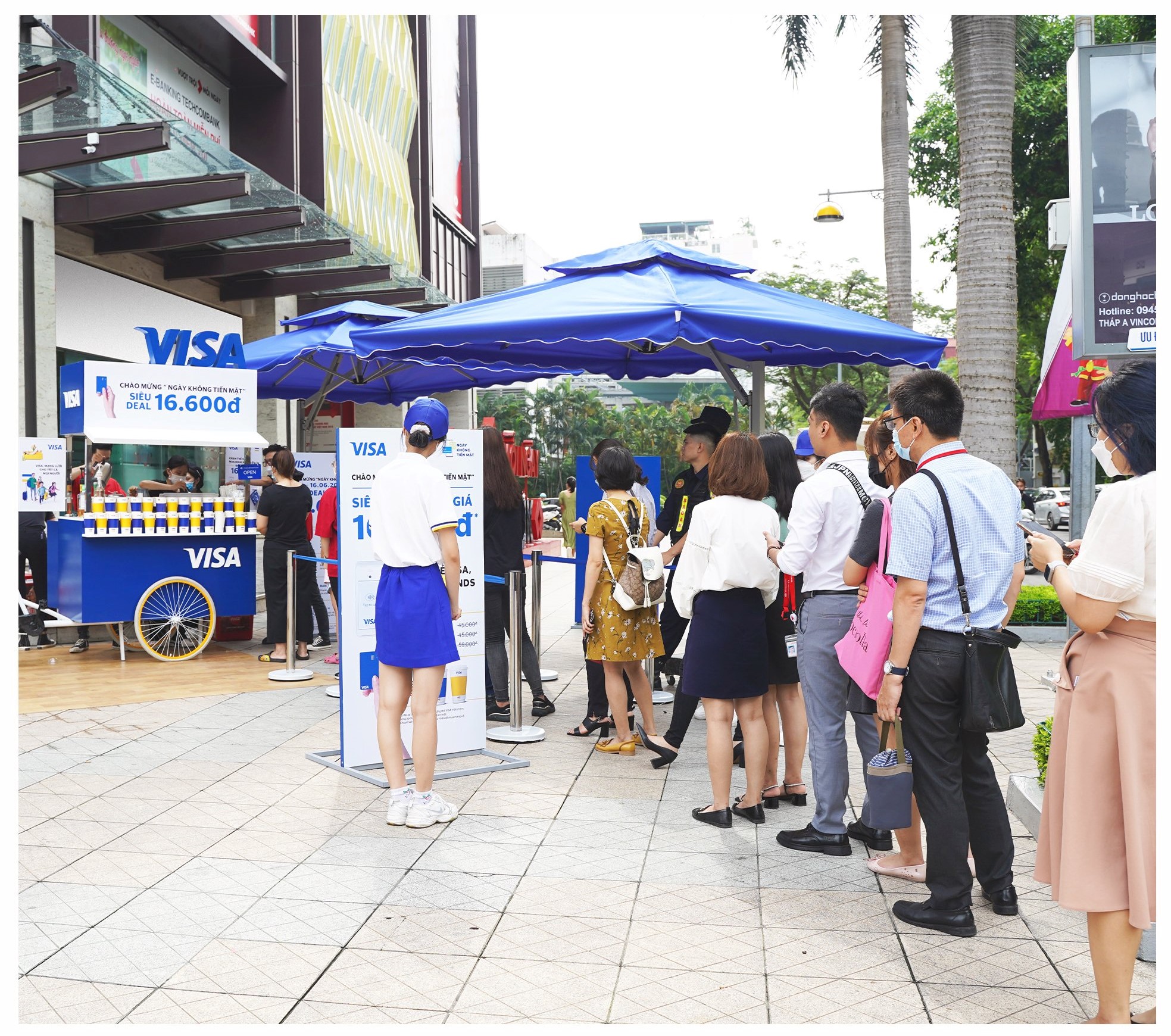 People queue for a coffee order at a contactless payment booth during a Cashless Day event in Hanoi this year.