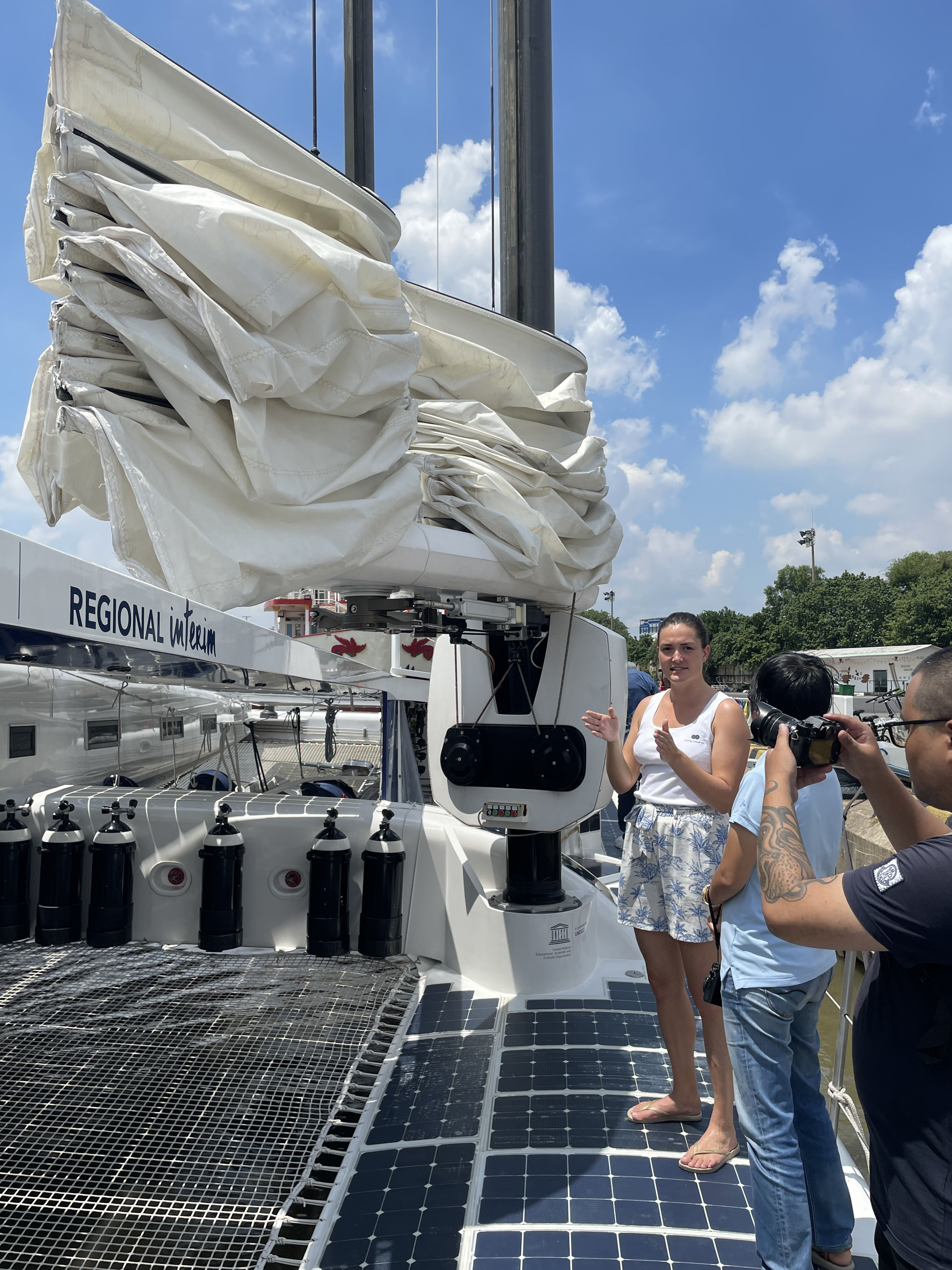 A crew member shows off the solar panels on the Energy Observer during its stopover in Ho Chi Minh City. Photo: Minh Khoi / Tuoi Tre