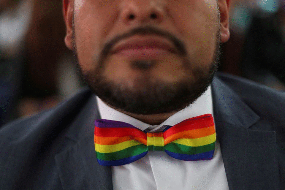 A man shows his bowtie as he celebrates LGBTQ+ pride month with a massive wedding of same sex couples in Mexico City, Mexico, June 24, 2022. Photo: Reuters