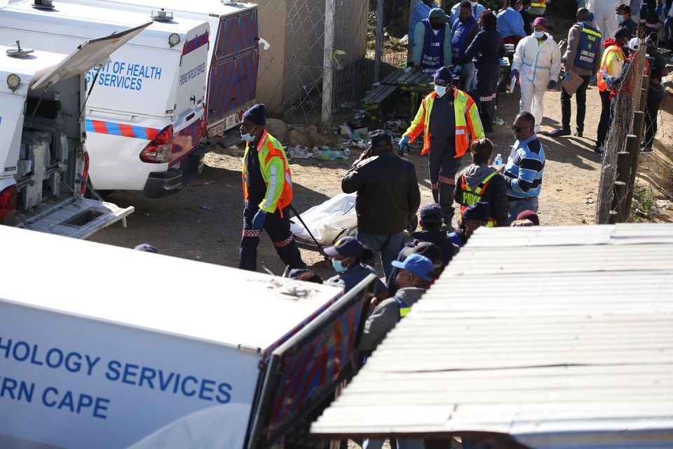 Forensic personnel load bodies of victims after the deaths of patrons found inside the Enyobeni Tavern, in Scenery Park, outside East London in the Eastern Cape province, South Africa, June 26, 2022. Photo: Reuters