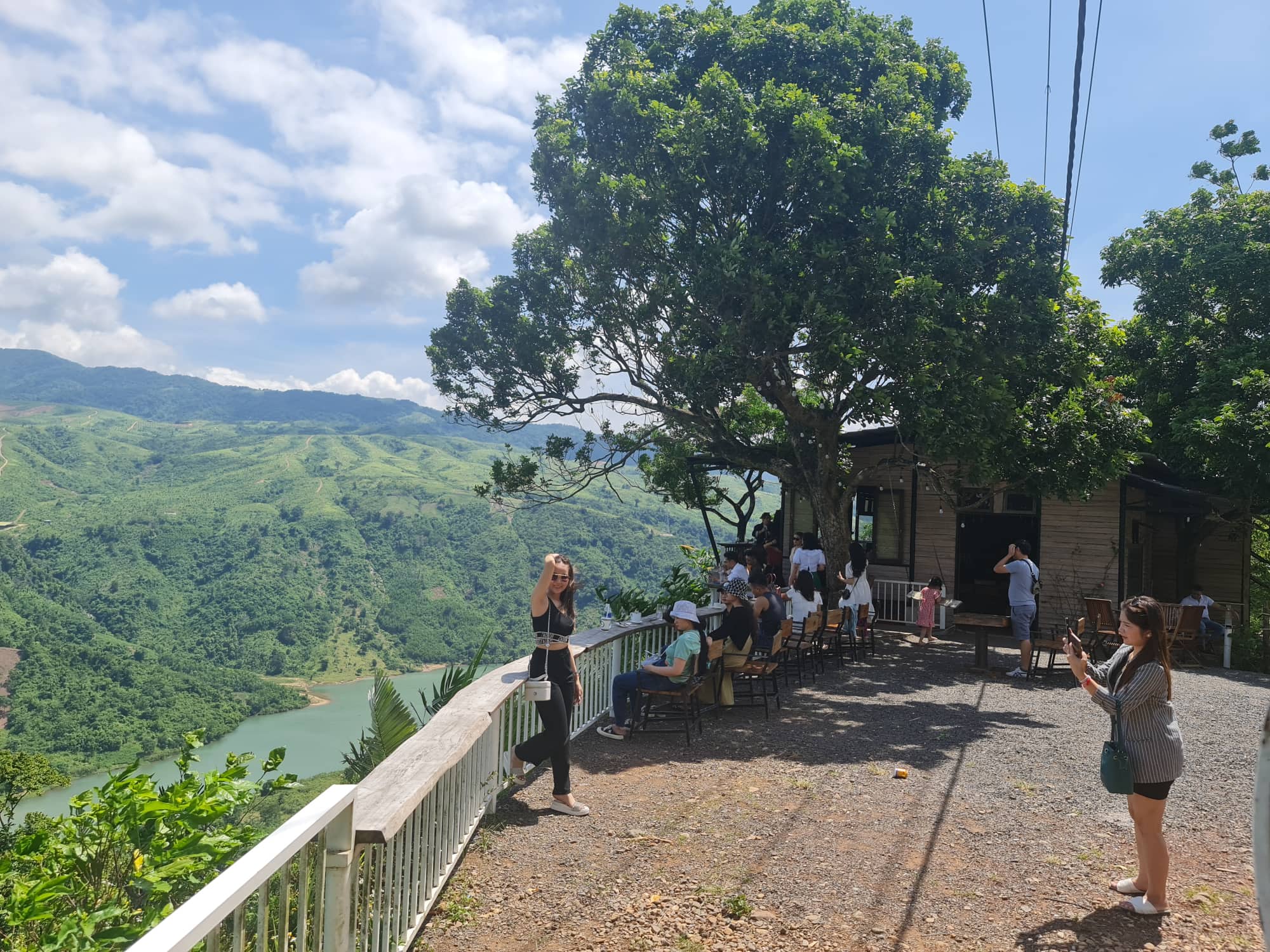 A visitor poses for a photo at Homi Coffee in Huong Hoa District, Quang Tri Province. Photo: Tran Mai / Tuoi Tre