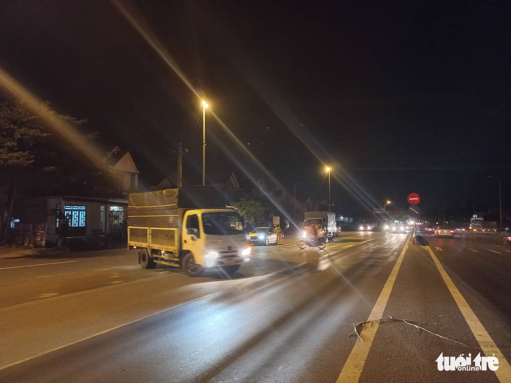 Traffic police officers turn vehicles away at the start of the Ho Chi Minh City-Long Thanh-Dau Giay Expressway, Vietnam, after a serial traffic accident, August 2, 2022. Photo: Duc Trong/ Tuoi Tre