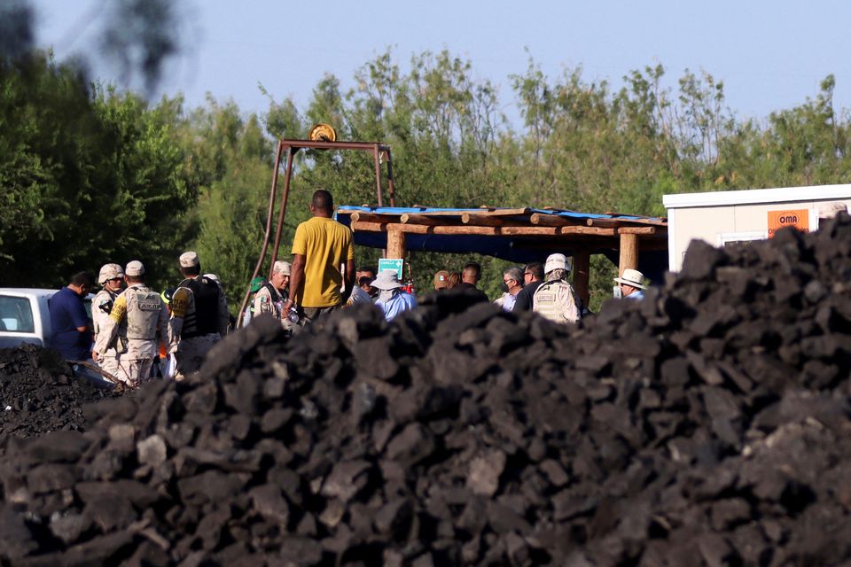 Authorities are pictured at the premises of a coal mine which collapsed leaving miners trapped, in Sabinas, in Coahuila state, Mexico, August 3, 2022. Photo: Reuters