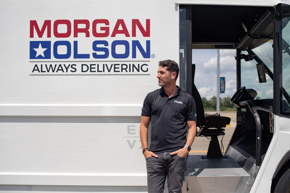 Daniel Barrel, CEO of REE Automotive stands in front of an electric vehicle on display at the American Center for Mobility in Ypsilanti, Michigan, U.S. July 28, 2022. Photo: Reuters