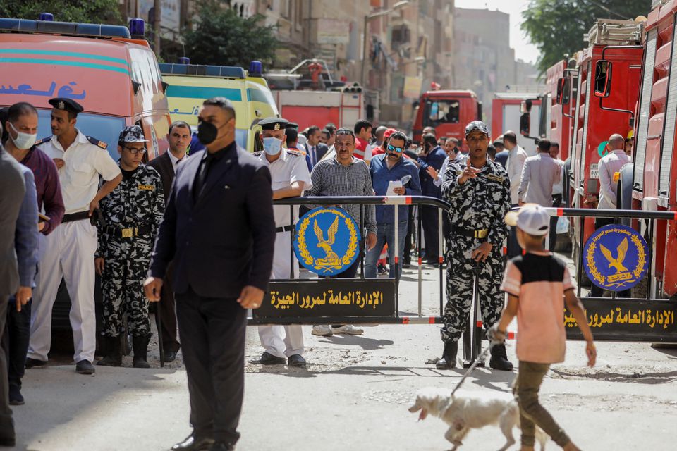 People and police gather near the scene where a deadly fire broke out at the Abu Sifin church in Giza, Egypt, August 14, 2022. Photo: Reuters